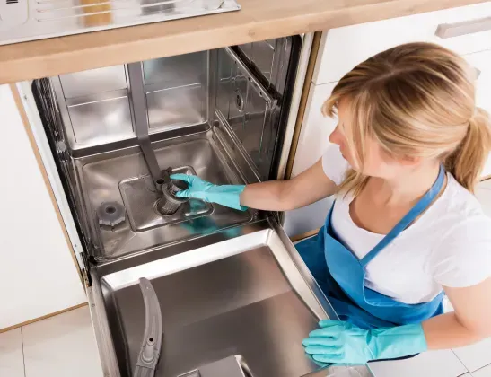 woman-cleaning-dishwasher-filter